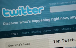 The Twitter homepage appears on a screen